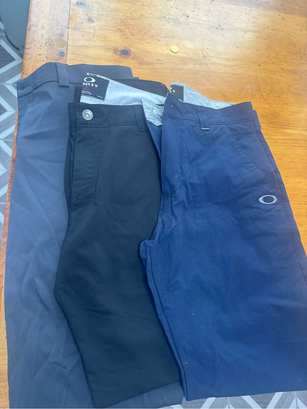 Oakley Men's Performance Pants — Navy and Black and one pair of slazenger pants